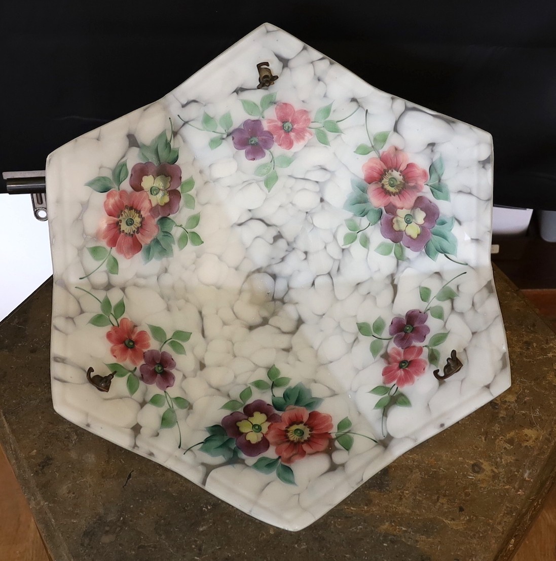 A 1930s hexagonal marbled glass light bowl with internal floral decoration, width 46cm